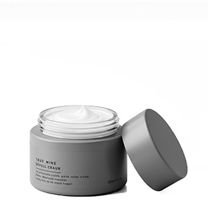 Pot cosmétique gris rempli de crème